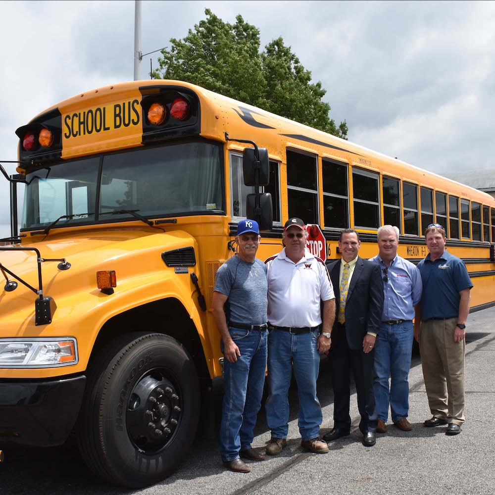 Wheaton R-III Bus Image with support staff